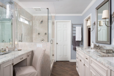 Example of a mid-sized transitional master beige tile and marble tile porcelain tile, brown floor and double-sink alcove shower design in Atlanta with furniture-like cabinets, beige cabinets, blue walls, an undermount sink, quartzite countertops, a hinged shower door, a niche and a built-in vanity