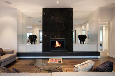 This is an example of a modern family room in Melbourne.
