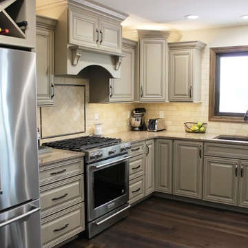 Farmhouse kitchen Taupe Painted Cabinets,Quartz Tops, and Dark Island