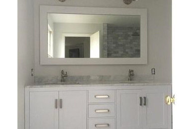 Small transitional master gray tile and marble tile marble floor and gray floor corner shower photo in Other with furniture-like cabinets, white cabinets and granite countertops