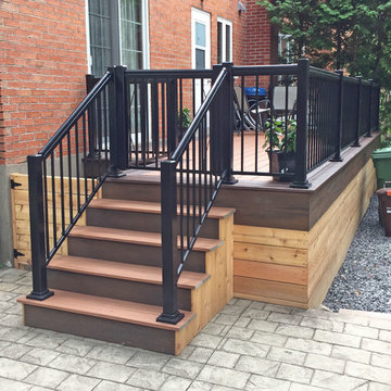 Tiki Torch Decking With Lava Rock Picture Frame and Cedar Wood Skirting