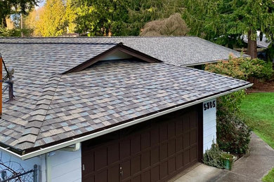 Inspiration for a one-story house exterior remodel in Seattle with a shingle roof