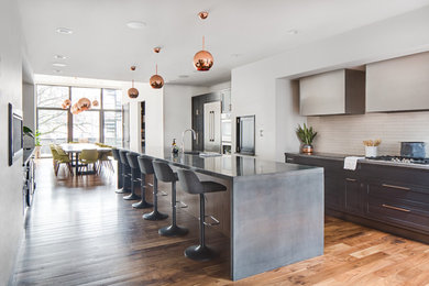 Eat-in kitchen - large transitional galley medium tone wood floor and multicolored floor eat-in kitchen idea in Cincinnati with an integrated sink, shaker cabinets, gray cabinets, concrete countertops, white backsplash, subway tile backsplash, stainless steel appliances, an island and gray countertops