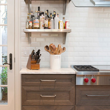 Industrial Kitchen with Stained Wood Cabinetry and Subway Tile
