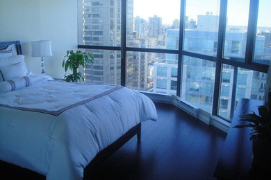Bedroom - guest dark wood floor bedroom idea in Vancouver with white walls and no fireplace
