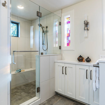 Large White Walk-In Shower with Large Format Tile and Stained Glass Window