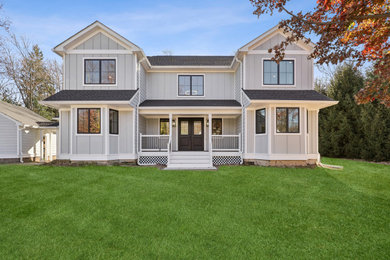 Example of a country exterior home design in New York
