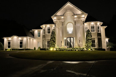 Inspiration for a huge white two-story concrete house exterior remodel in Atlanta with a shingle roof and a brown roof