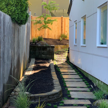 Deck platform, fence, hardscape, garden and planters.