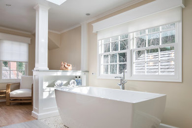 Mid-sized elegant master porcelain tile and beige floor bathroom photo in DC Metro with shaker cabinets, light wood cabinets, beige walls, a vessel sink, marble countertops and a hinged shower door