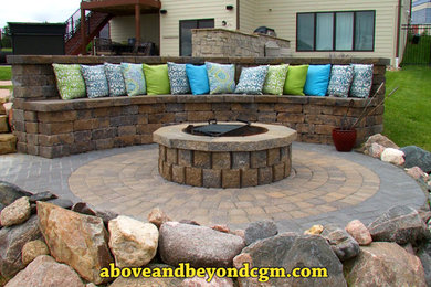 Large backyard garden in Omaha with a fire feature.