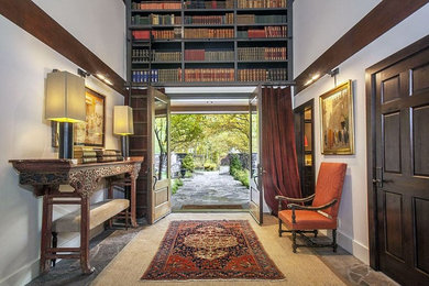 Inspiration for a mid-sized transitional granite floor entryway remodel in Other with white walls and a glass front door