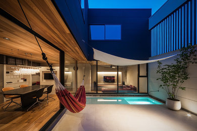 Design ideas for a modern courtyard rectangular pool in Osaka.