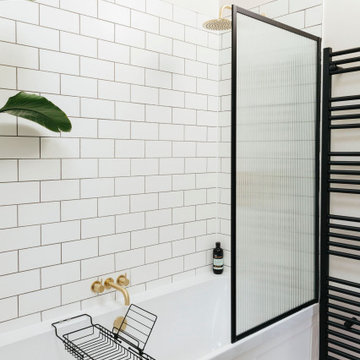 Pink & green bathroom with mix of tiles & patterns
