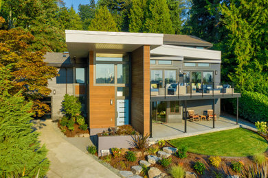 Contemporary gray two-story wood exterior home idea in Seattle