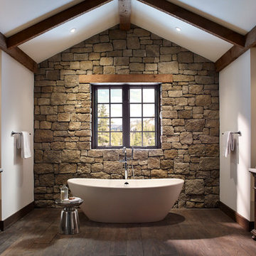 Rustic Stone Wall Bathroom With Open Tub