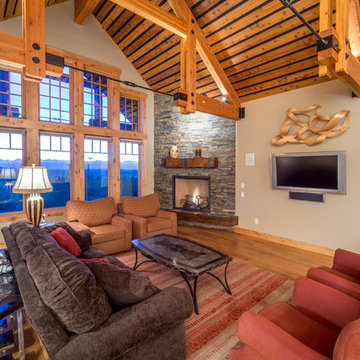 Brasada Ranch home living room and corner fireplace wood flooring