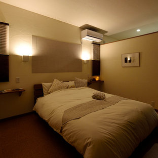 Inspiration for a mid-sized master bedroom in Other with white walls, cork floors, no fireplace and brown floor.