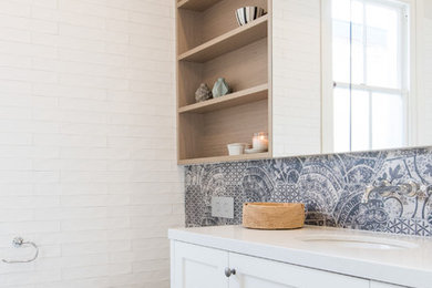 Photo of an eclectic master bathroom in Melbourne with shaker cabinets, white cabinets and engineered quartz benchtops.