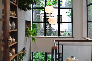 Example of a large transitional home design design in New York