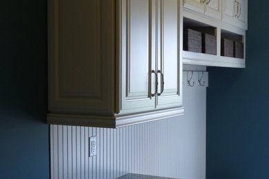 Inspiration for a small timeless ceramic tile and beige floor mudroom remodel in Philadelphia with white walls