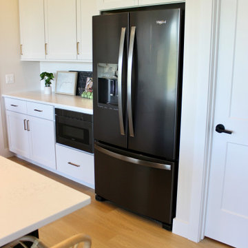 Great Room Kitchen with Black and White Cabinets in Bettendorf Iowa