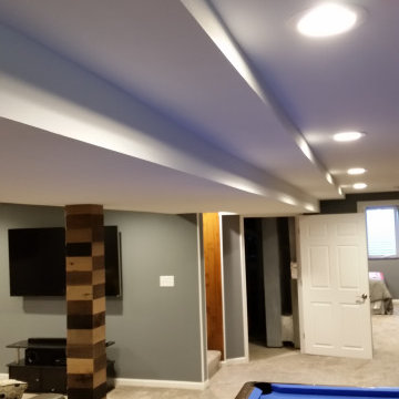 Basement rec room with custom bar and bedroom