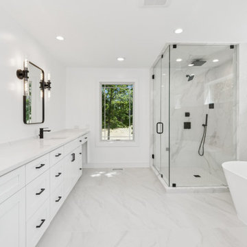 Sophisticated Spa Master Bath with Freestanding Tub, Glass Shower & Double Vanit