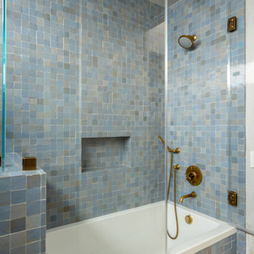 Bathroom with Blue Tile Walls and Built-In Tub Niche