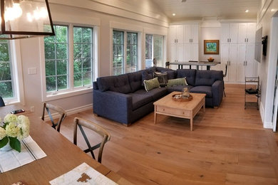 Family room - coastal open concept light wood floor family room idea in Other