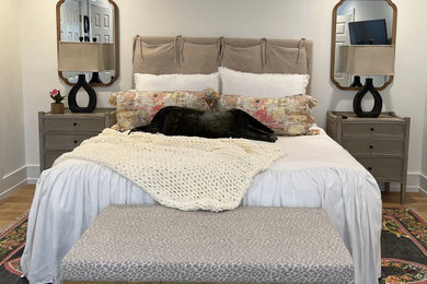 Inspiration for a mid-sized french country guest light wood floor and brown floor bedroom remodel in Birmingham with white walls