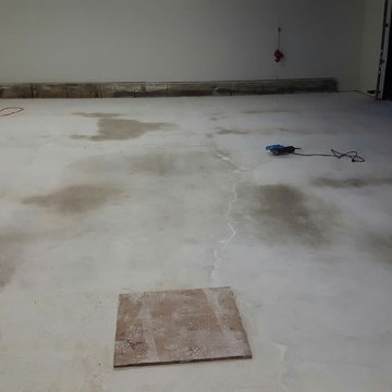 Oil, Cracks, Uneven Floor, Cold Weather, Unhappy Client