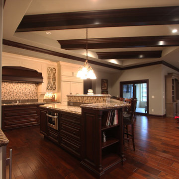 Three Level Island with Bar Height Seating and Display Shelves