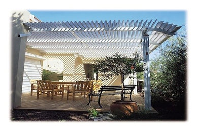 Patio - small backyard patio idea in Phoenix with a roof extension