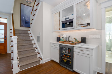 Inspiration for a contemporary home bar remodel in Philadelphia with shaker cabinets
