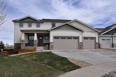 Inspiration for a mid-sized craftsman two-story concrete fiberboard gable roof remodel in Denver