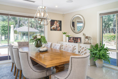 This is an example of a transitional dining room in Townsville.