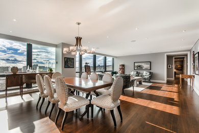 Inspiration for a mid-sized contemporary medium tone wood floor great room remodel in Montreal with gray walls