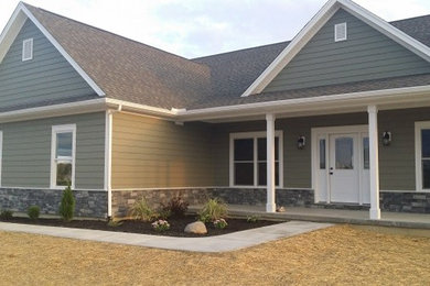Inspiration for a mid-sized beige two-story mixed siding exterior home remodel in Cincinnati