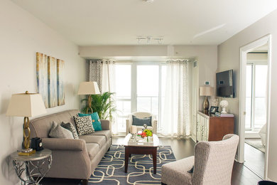Inspiration for a small transitional open concept dark wood floor living room remodel in Toronto with a wall-mounted tv