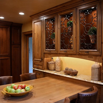 Mediterranean Luxury Kitchen Remodel | Stone Accents & Arched Detailing