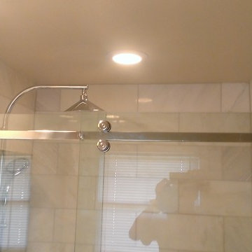 BATHROOM - Calcutta Gold Marble Shower / Gray Penny Tile Floor