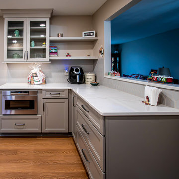 Two-Tone Neutral Kitchen with Quartz Countertop and Soho Picket Backsplash