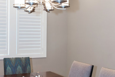 Inspiration for a contemporary carpeted enclosed dining room remodel in Sacramento with beige walls