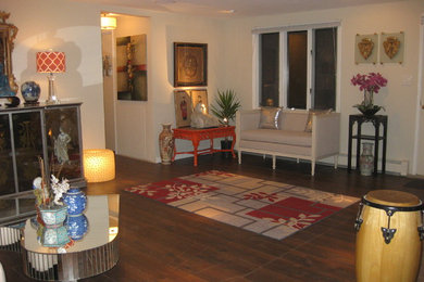 Living room - large eclectic formal and open concept dark wood floor and brown floor living room idea in New York with beige walls, a standard fireplace, a brick fireplace and no tv