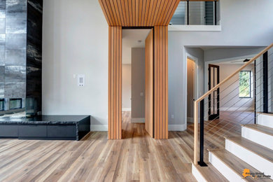 Inspiration for a contemporary gray floor, wood ceiling and wood wall hallway remodel in Other