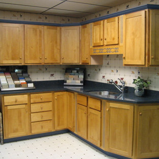 Kitchen pantry appliance - L-shaped ceramic floor kitchen pantry photo in Portland Maine with a double-bowl sink, shaker cabinets, medium tone wood cabinets, granite countertops, white backsplash, ceramic backsplash, stainless steel appliances and no island