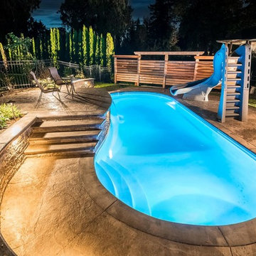 Fiberglass pool with raise patio and water featur