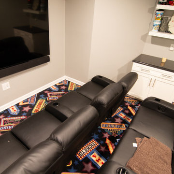Basement Utilizing Open Space to Shoot Pool and Watch Favorite Sports Team