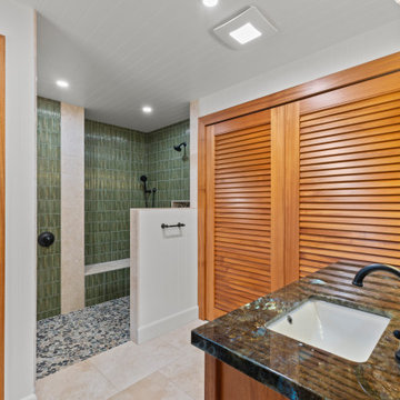 “Mauka Bathroom with Bamboo-Inspired Tile, Pebble Shower Floor, and Labradorite